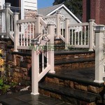 fence with stairs leading to house front door