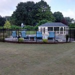 black steel fence around pool